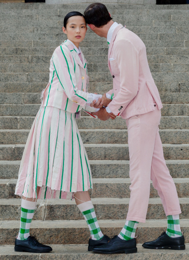 rocky and xiao wearing pink and green in new york.